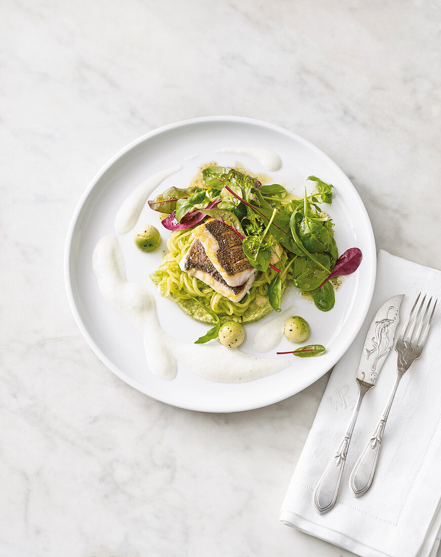 Fried sea bass with avocado and cucumber foam