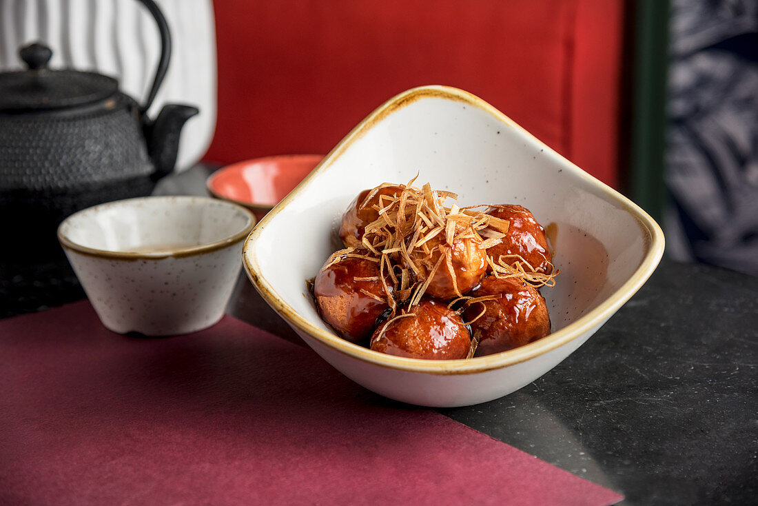 Filipino style fish balls topped with crispy leeks