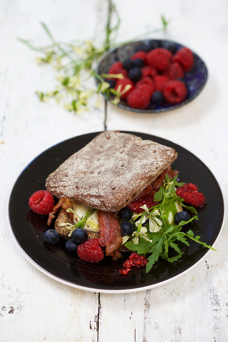 Sandwich with rucola and raspberries