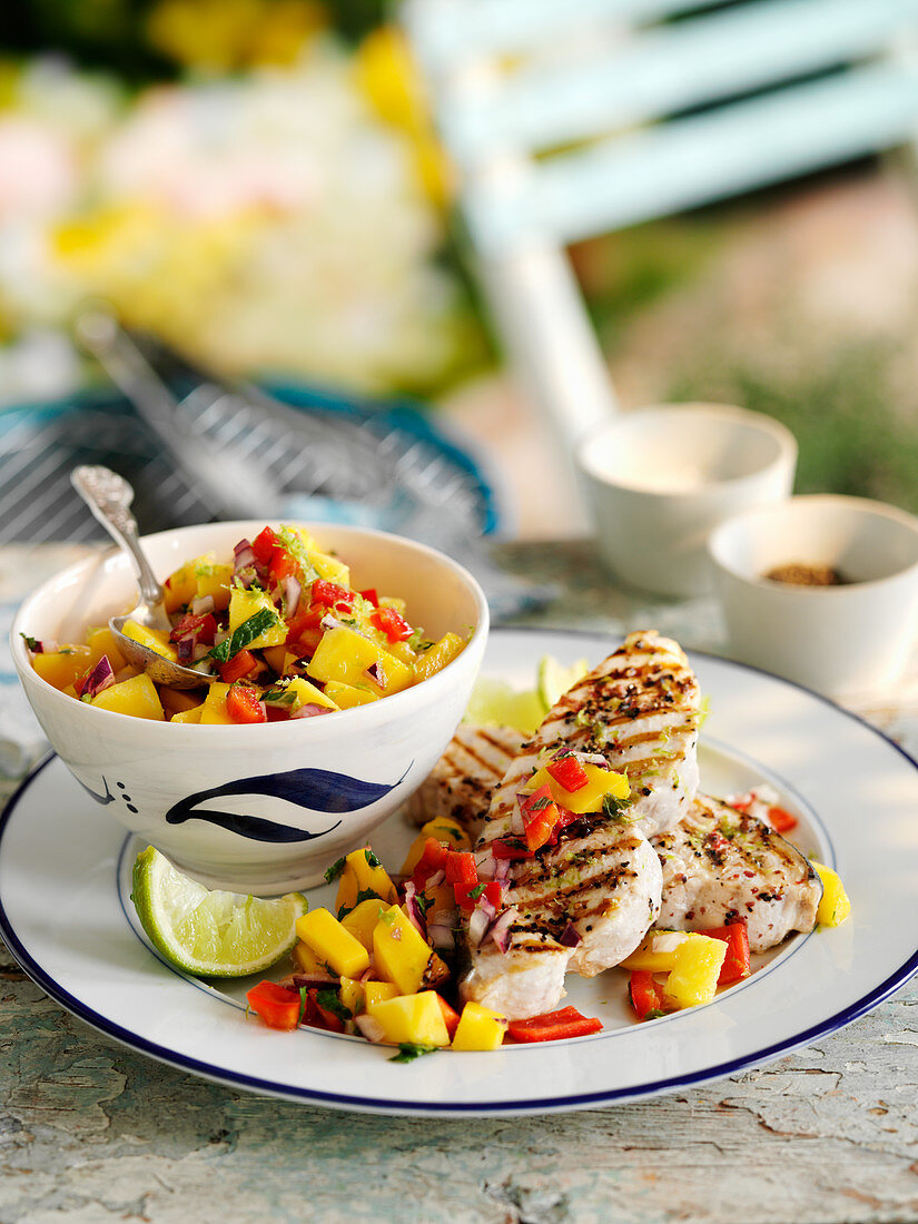 Grilled swordfish steaks with red pepper and mango salsa