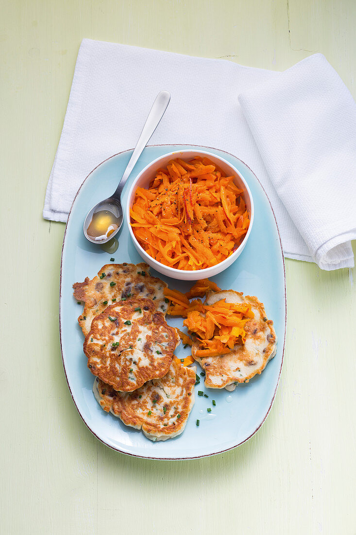 Quark fritters with a raw pumpkin and carrot salad