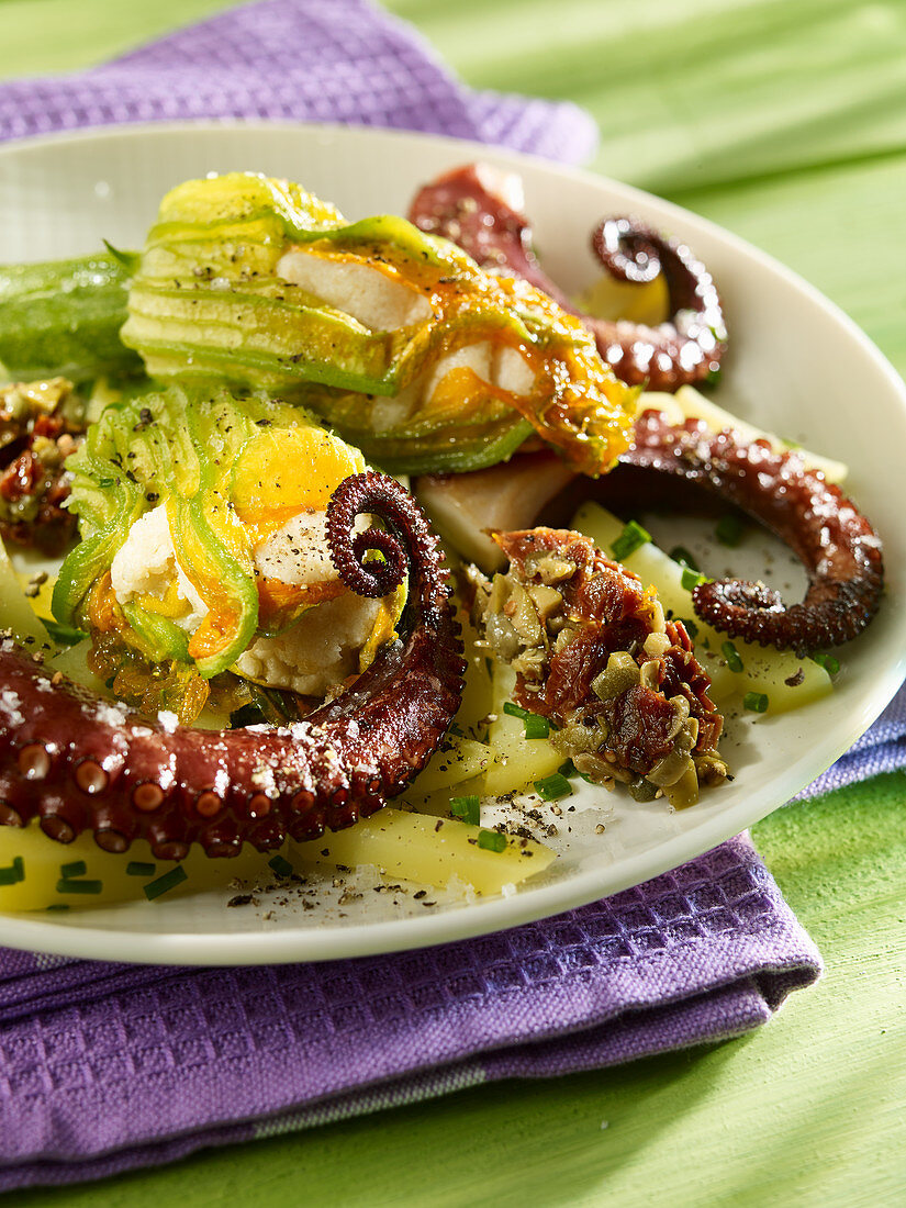 Fried octopus with stuffed courgette flowers