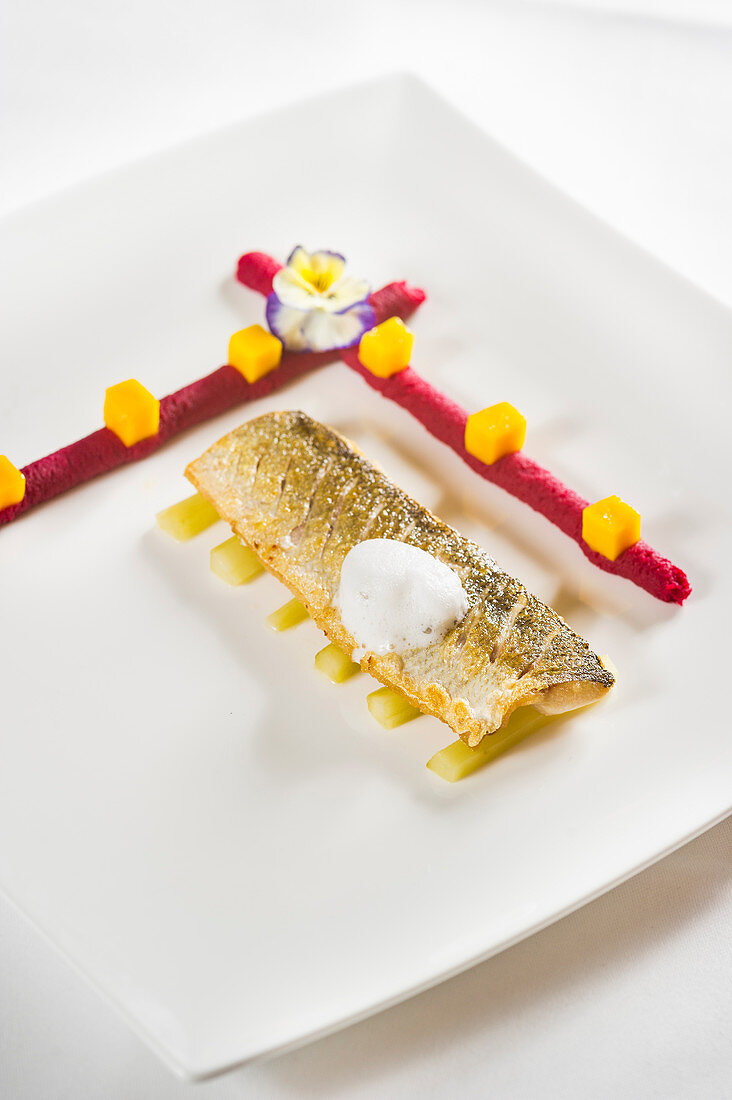 Whitefish on mustard gherkins with beetroot purée and mango