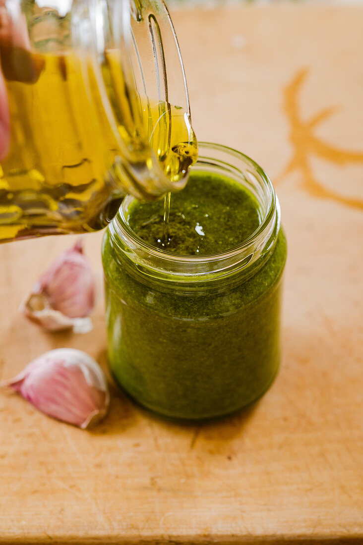 Herb pesto with a layer of oil