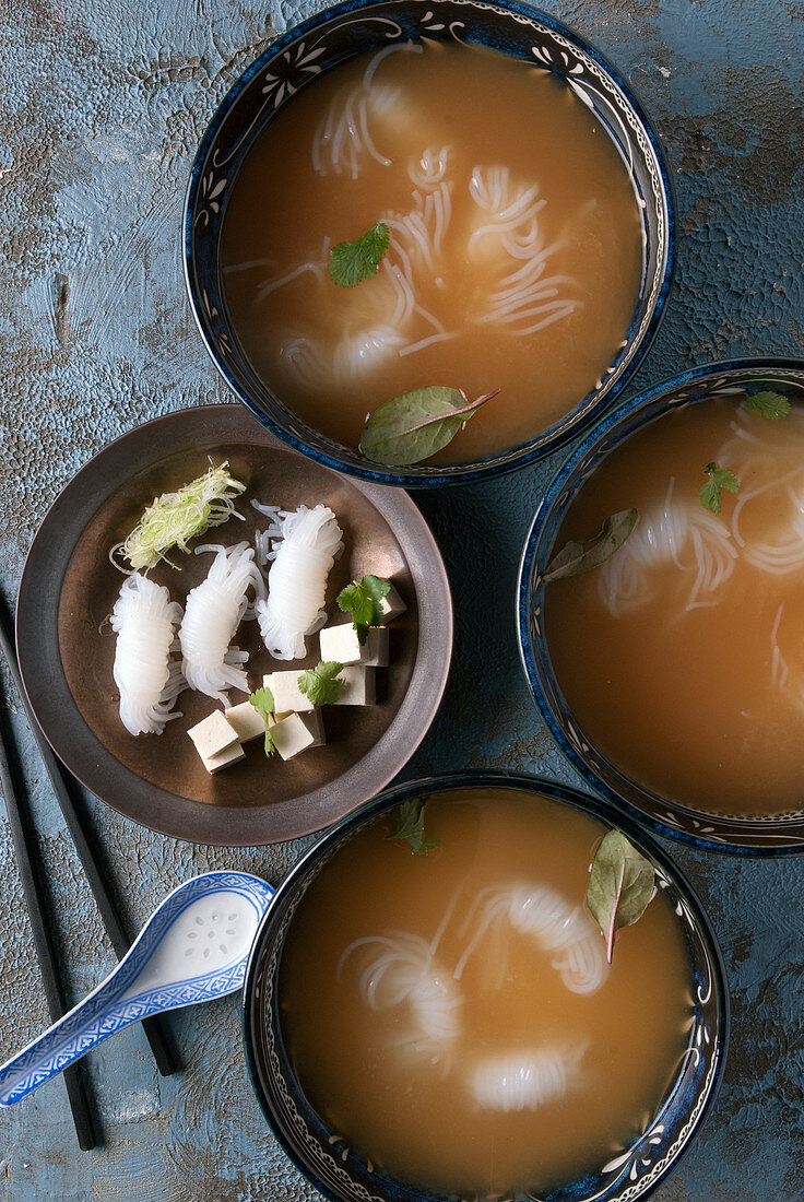 Bowls of miso soup with noodles and tofu