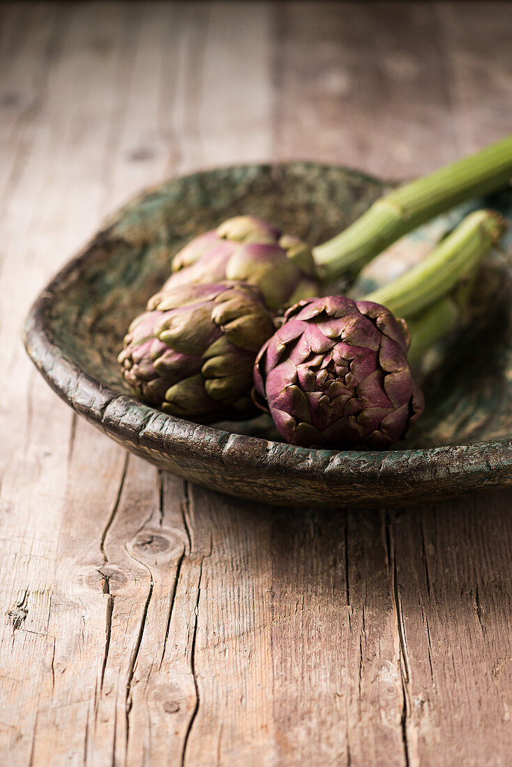 Artichokes in a wooden bowl