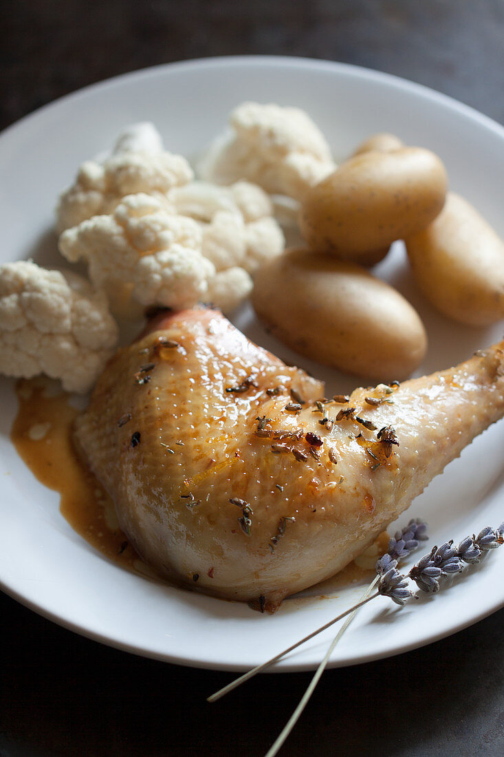 Chicken leg with lavender flowers, cauliflower and potatoes