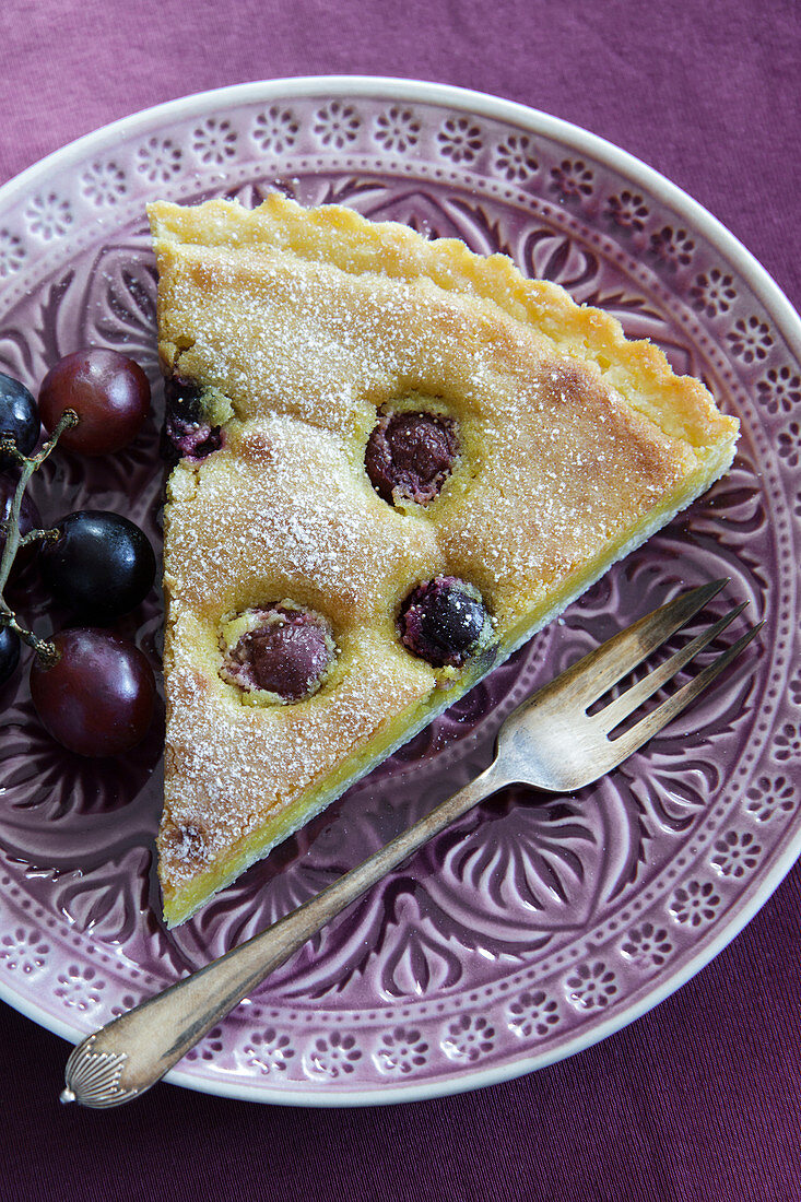 A piece of grape tart