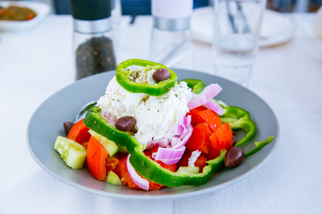 Horiatiki greek salad with fresh goat cheese
