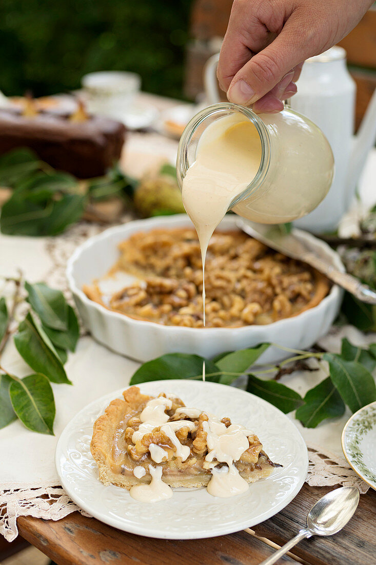 Pear pie with nuts and vanilla sauce