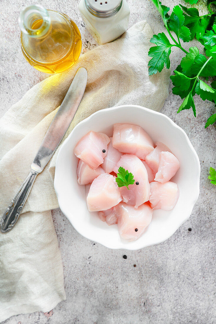 Chicken breast in small pieces ready to cook