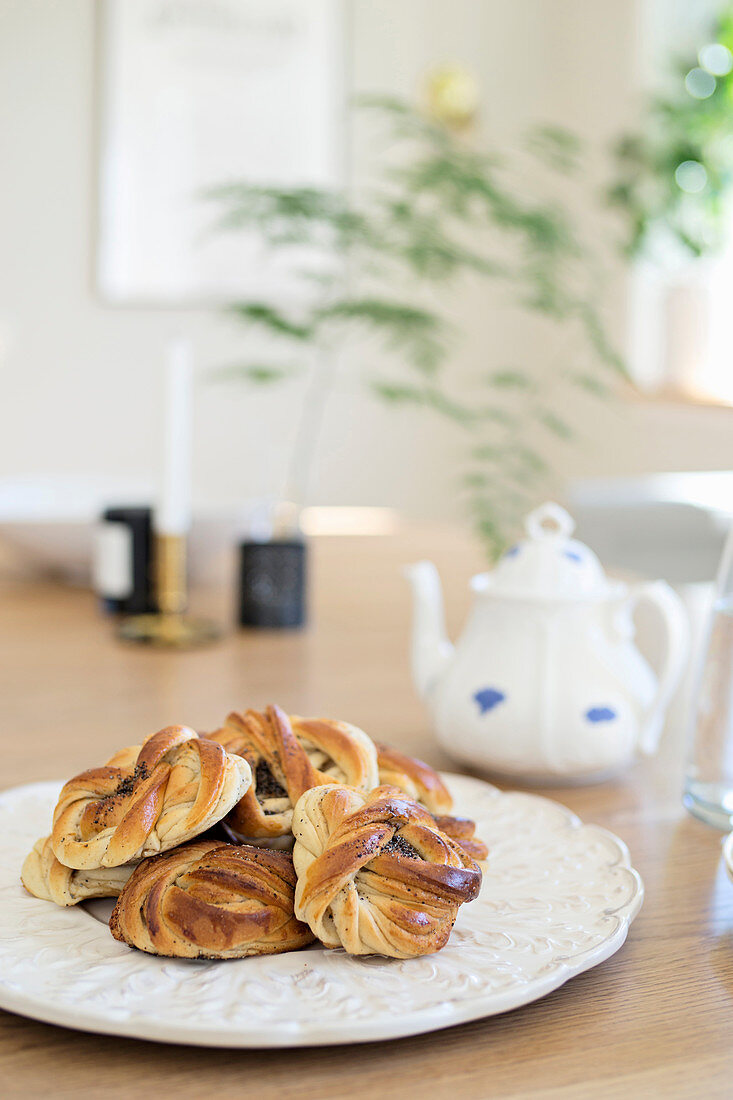 Poppy seed pastries on white plate