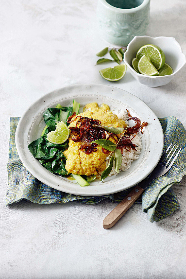 Fish cooked in yoghurt with crispy onion topping