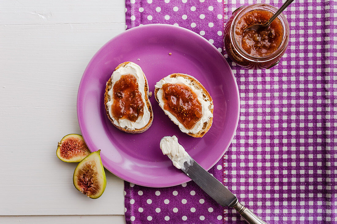 Fig jam in a jar and on bread