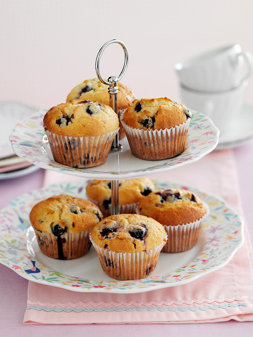 Berry muffins on a cake stand