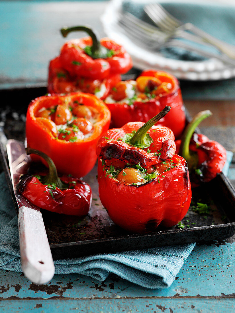 Stuffed peppers with cherry tomatoes and basil