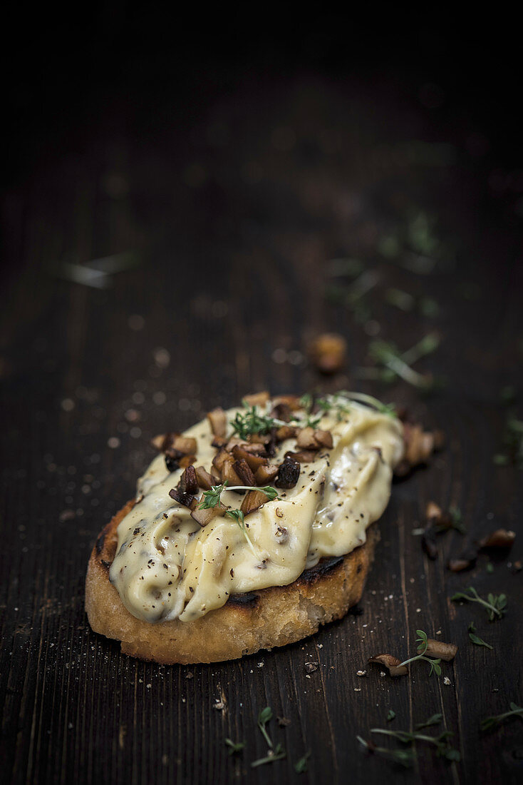 Grilled bread topped with butter, mushrooms and cress