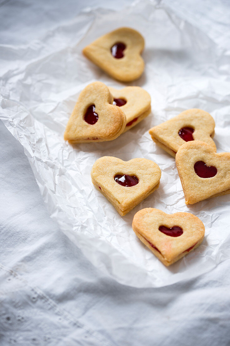 Vegan shortbread jam biscuits filled with strawberry fruit spread