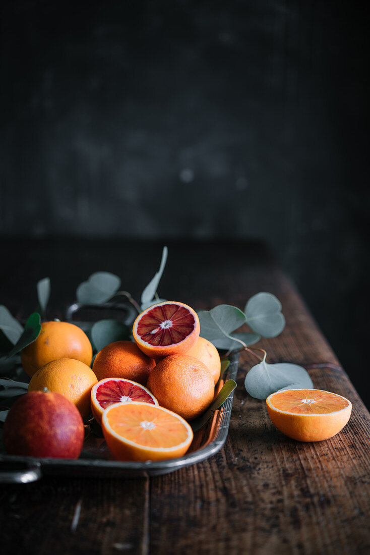 Blood oranges, whole and halved