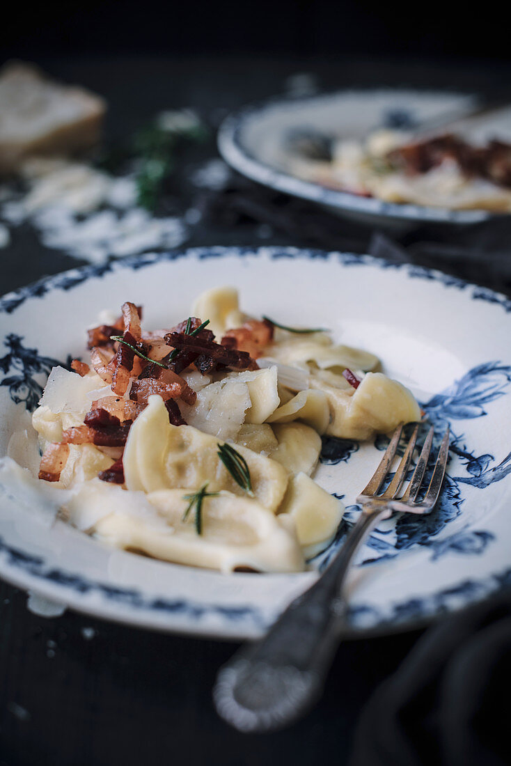 Scarpinocc (filled pasta, Italy) with ham, cheese and rosemary