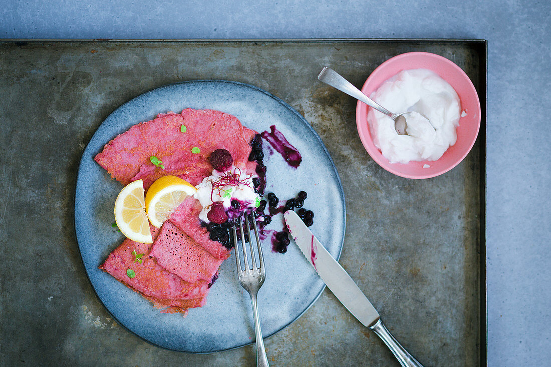 Beetroot crepes with blueberry compote and coconut yoghurt