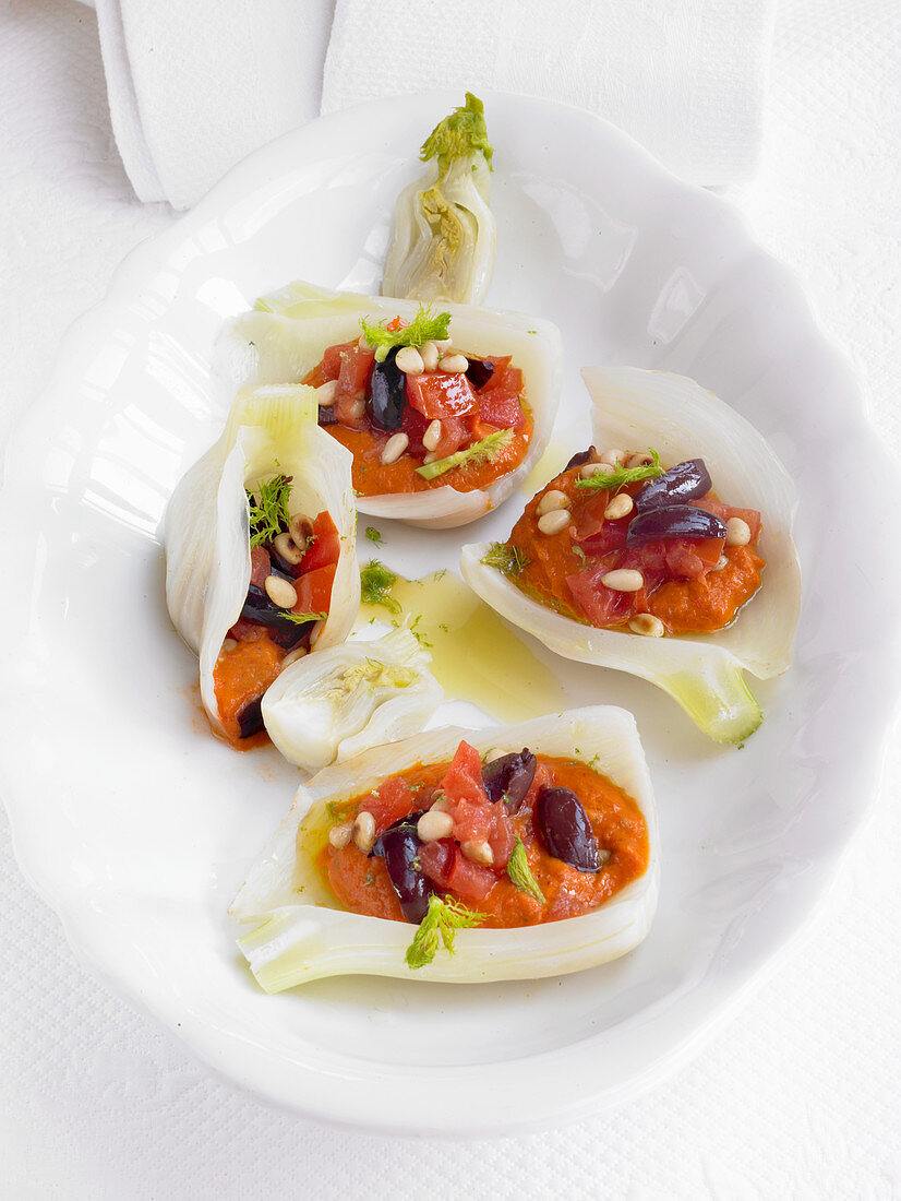 Mediterranean style fennel filled with olives, pine nuts and peppers