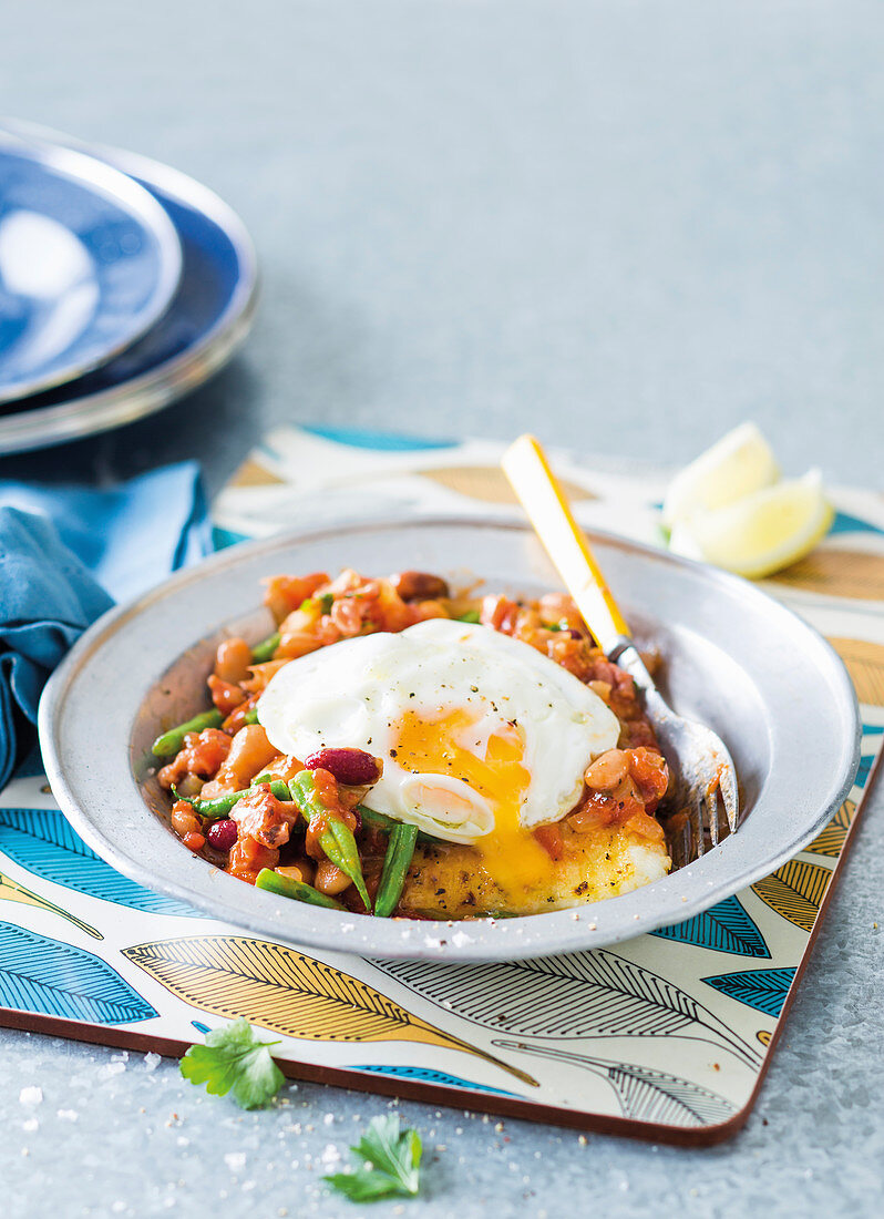 Grilled pap with saucy beans and fried egg