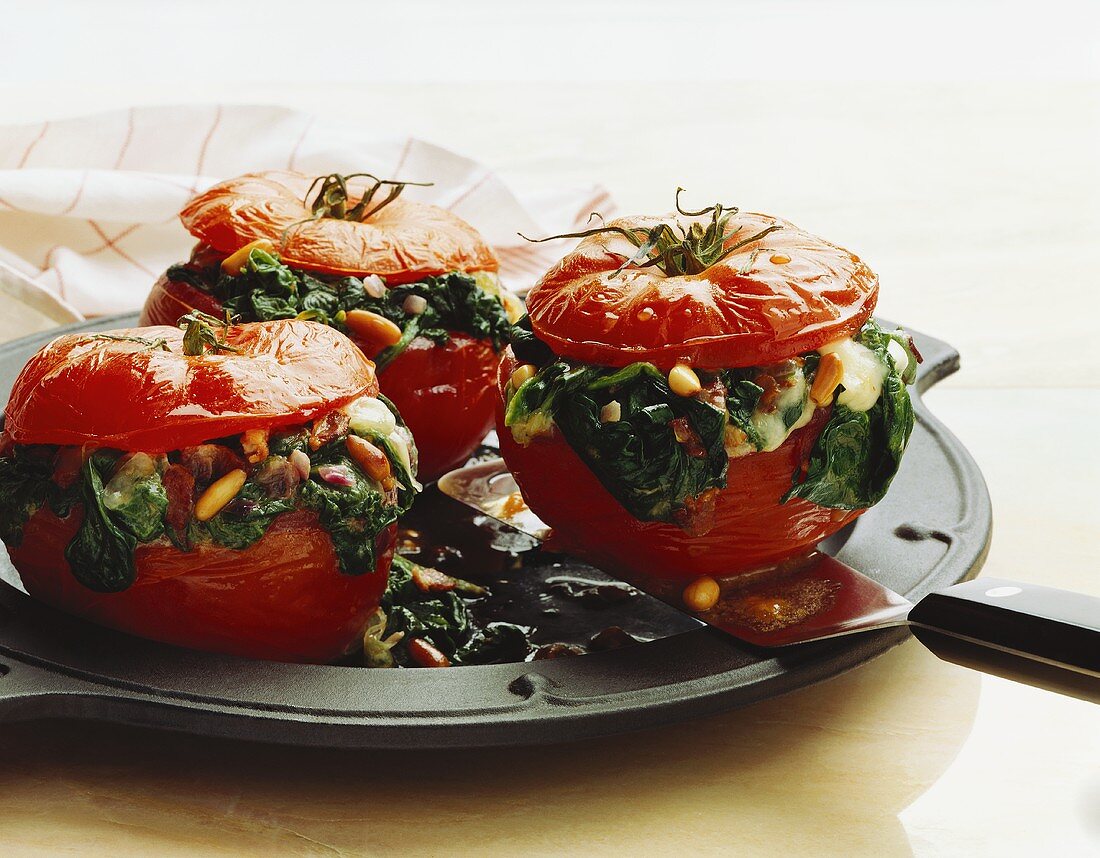 Three Tomatoes Stuffed with Spinach and Pine Nuts