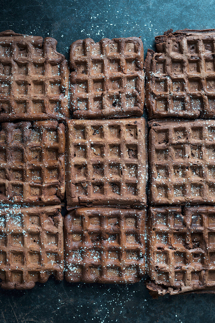 Chocolate waffles dusted with icing sugar (vegan)