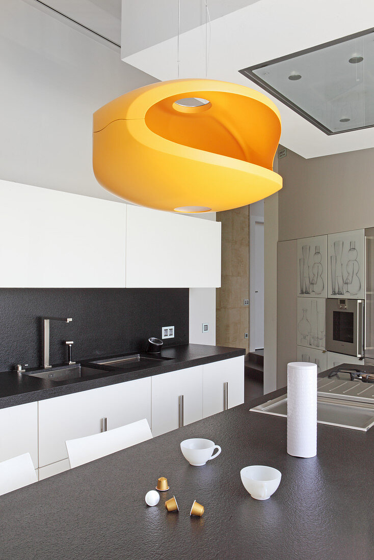 Modern orange designer lamp in kitchen