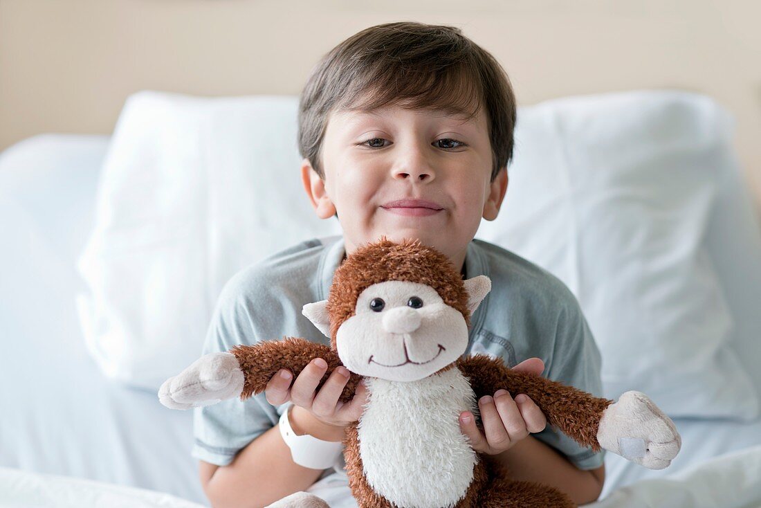 Boy in hospital with teddy bear