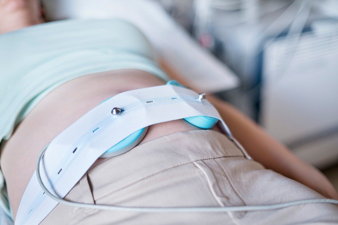 Pregnant woman with foetal heart rate monitor