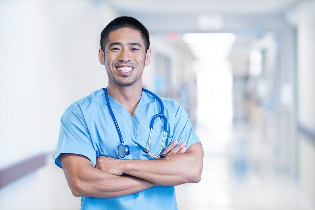 Male doctor smiling towards camera