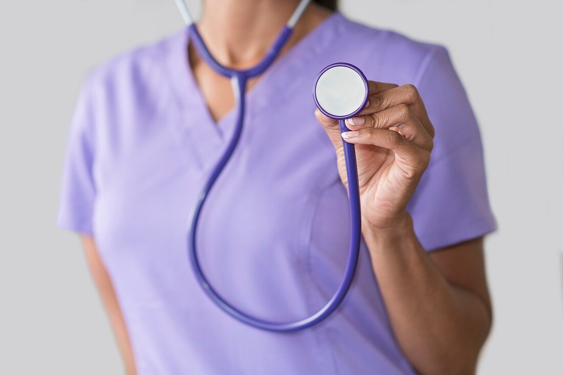 Female doctor holding stethoscope