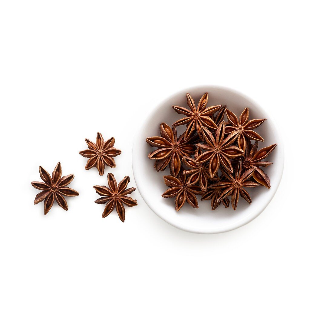 Star anise in white bowl