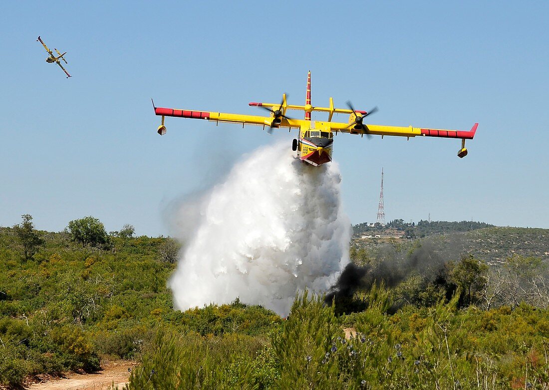 Aircraft dropping fire retardant
