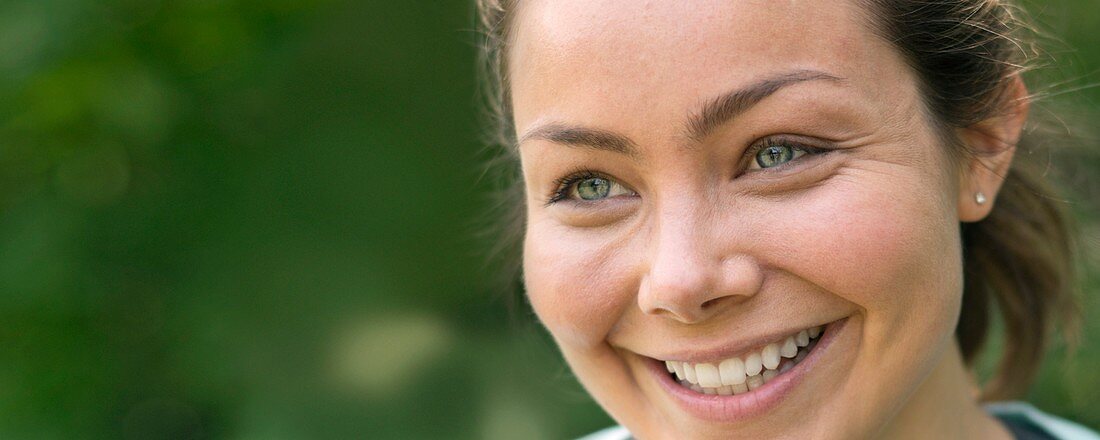 Woman smiling and looking away