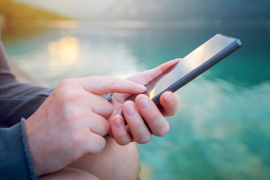 Woman using smartphone outdoors