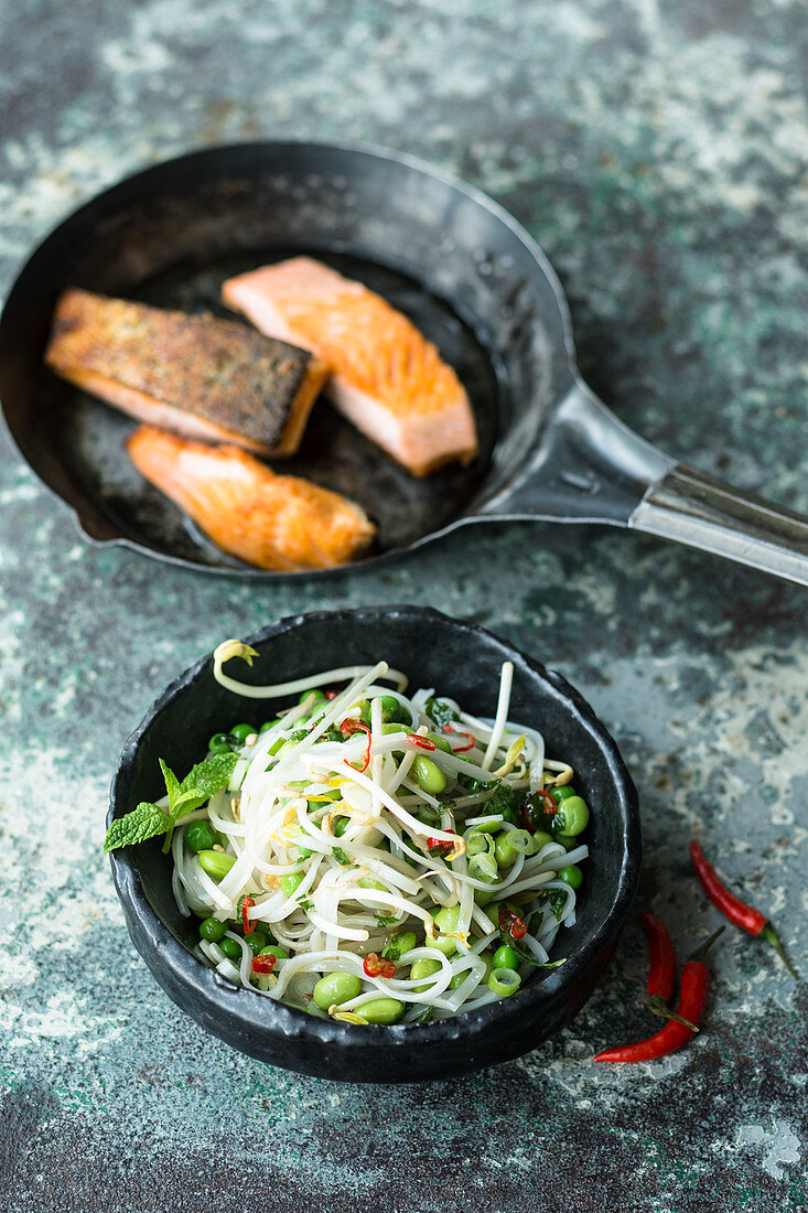 Crispy salmon with edamame and rice noodle salad