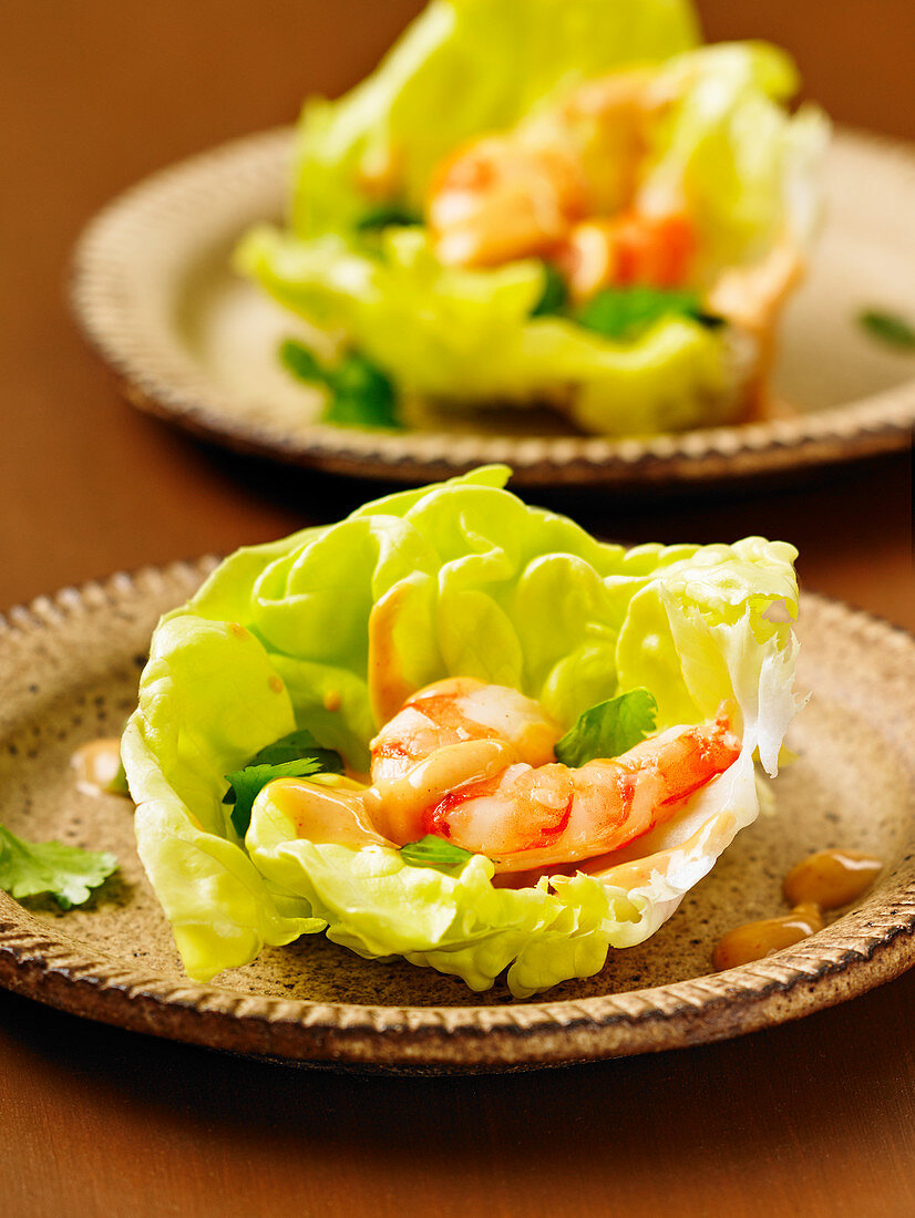 Sous vide shrimp lettuce wraps with spicy peanut sauce