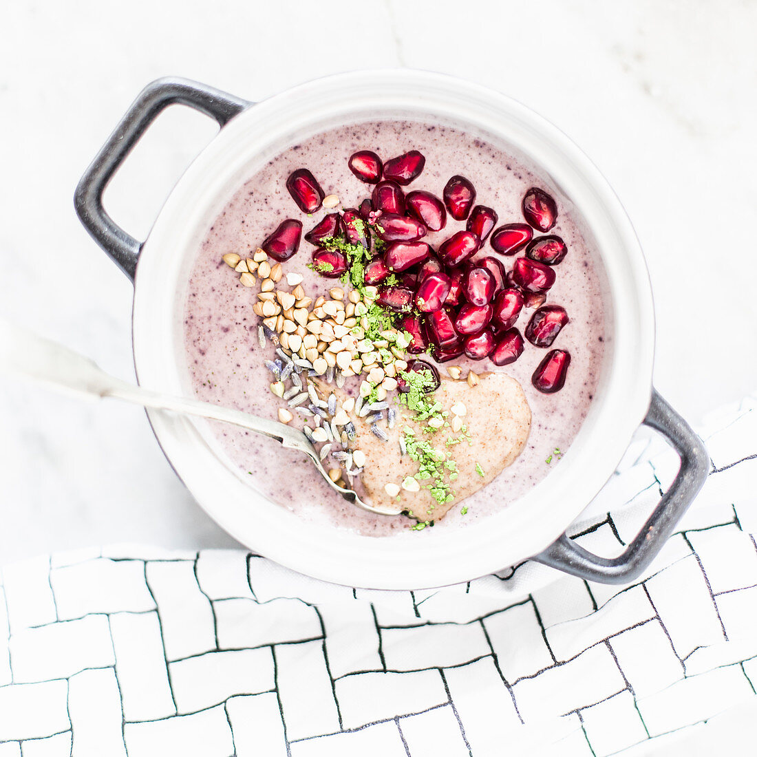 Buckwheat porridge with acai berries, pomegranate, matcha, lavender and almond mousse