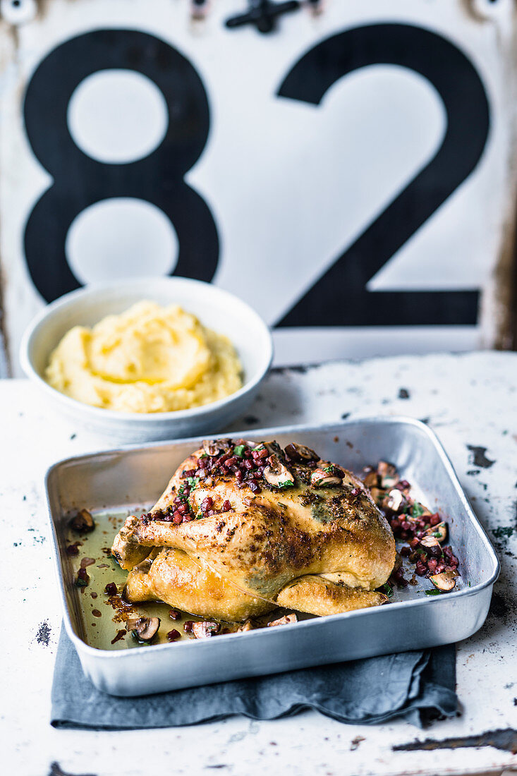 Fried chicken deluxe topped with bacon and mashed potatoes