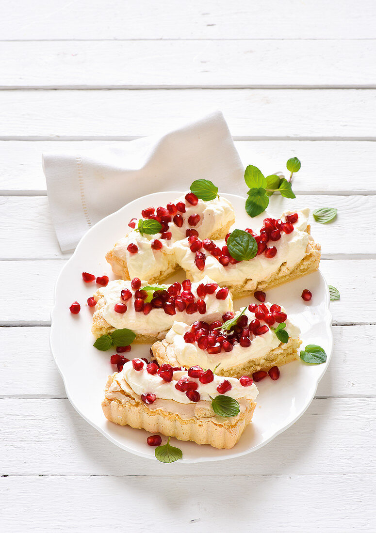 Macaroon slices with pomegranate seeds