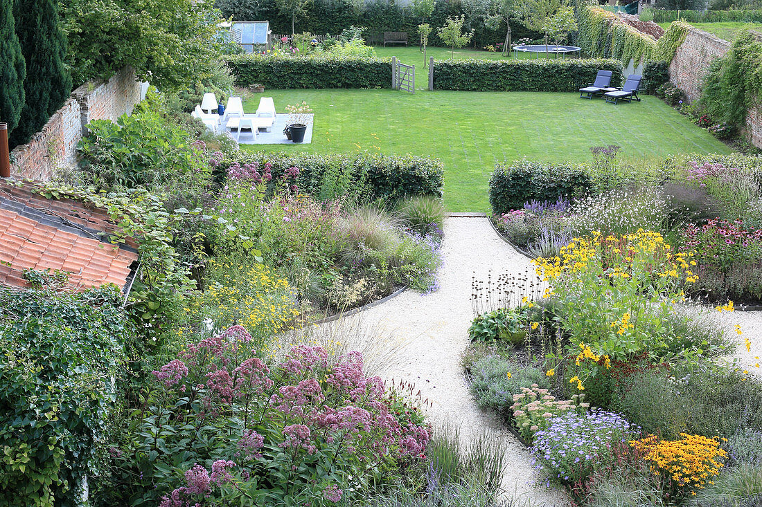 View down into garden divided into three sections by hedges