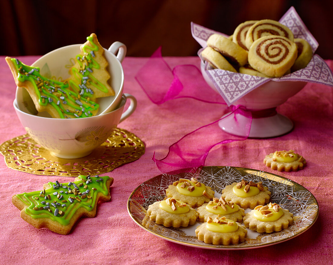 Christmas biscuits for tea: black-and-white spirals, Christmas trees and orange biscuits