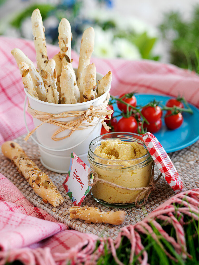 Bread sticks and hummus (picnic food)