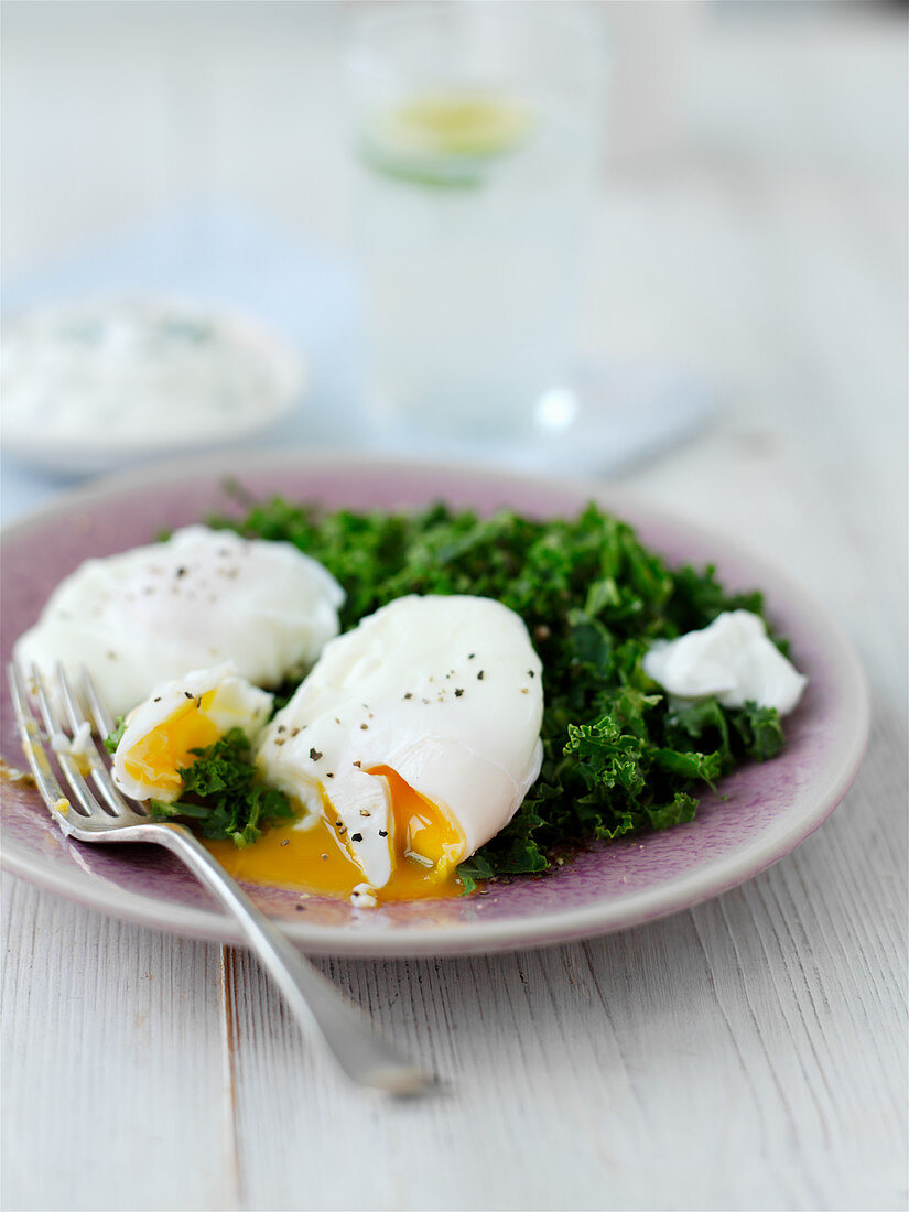 Middle eastern kale salad with poached eggs