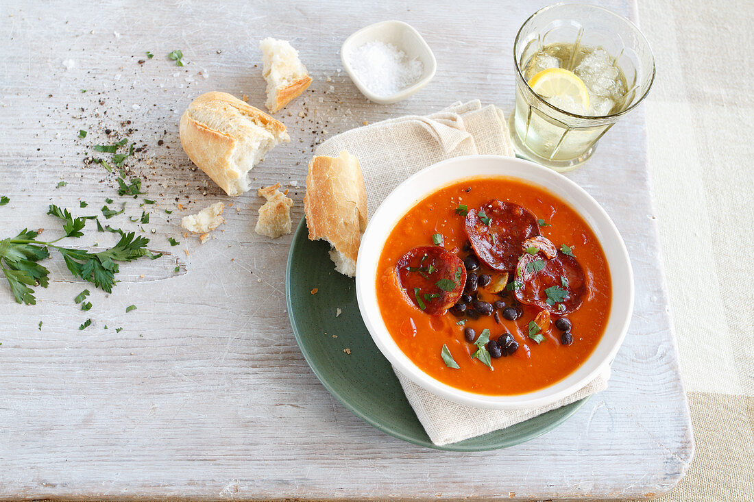 Pumpkin soup with sausage and baguette