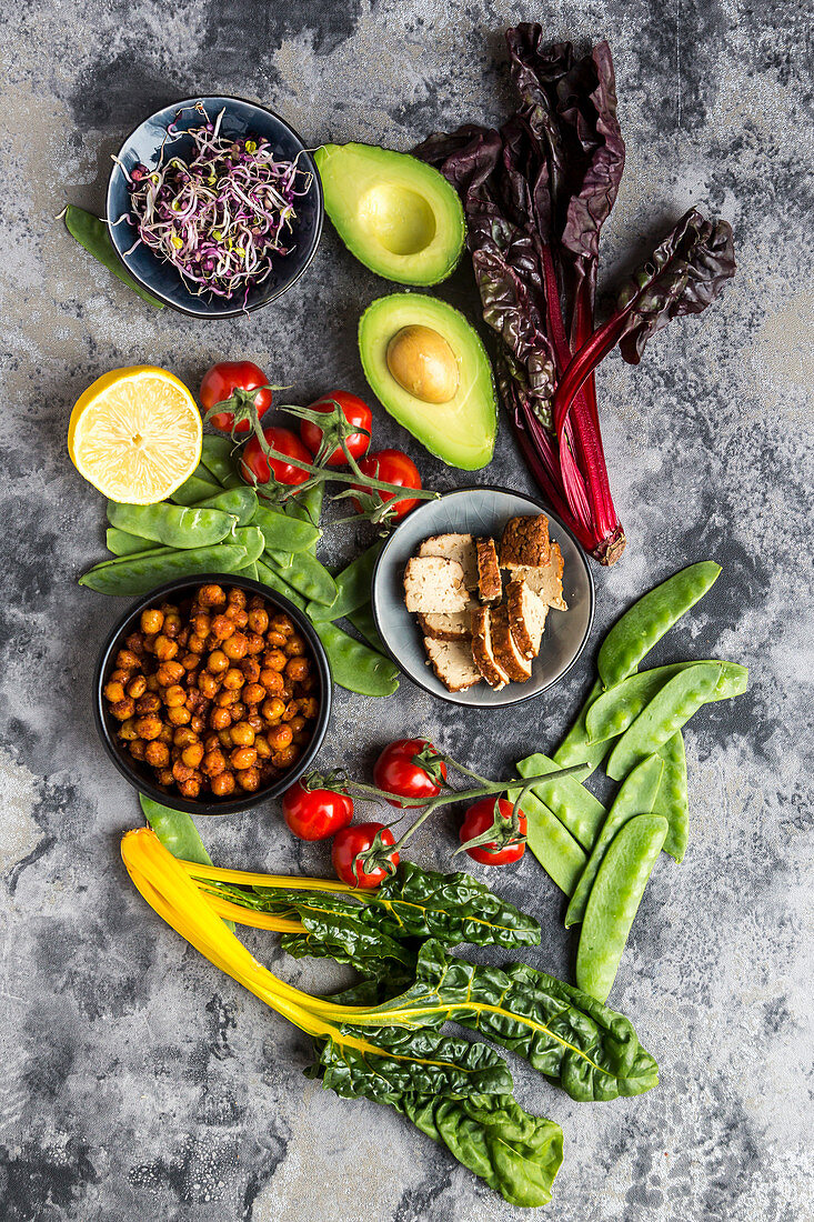 Fried chickpeas, tomatoes, avocado, chard, mangetout, smoked tofu, sprouts and lemon