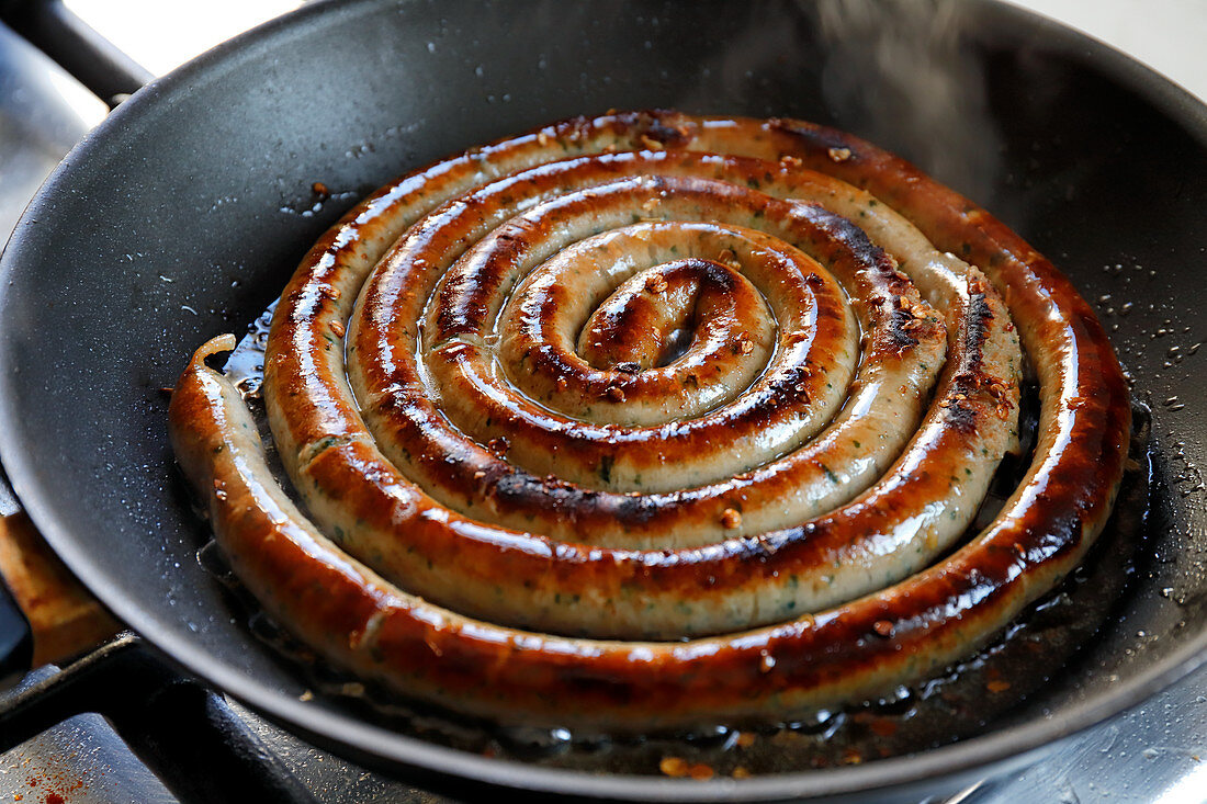 A sausage snail in a pan